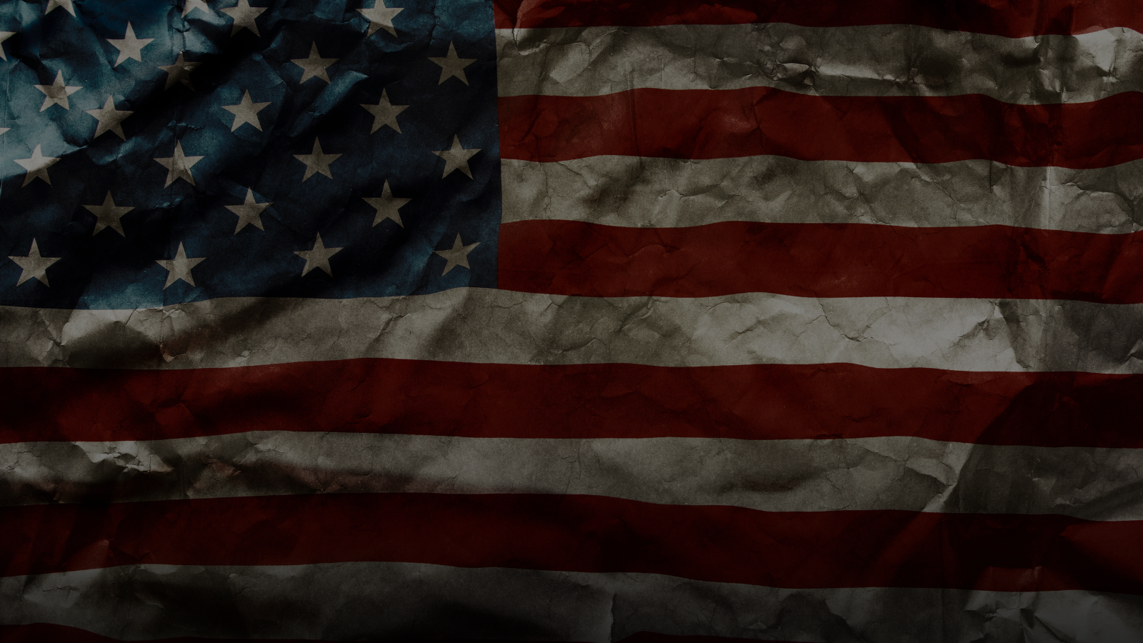 Worn American flag with visible creases and textures