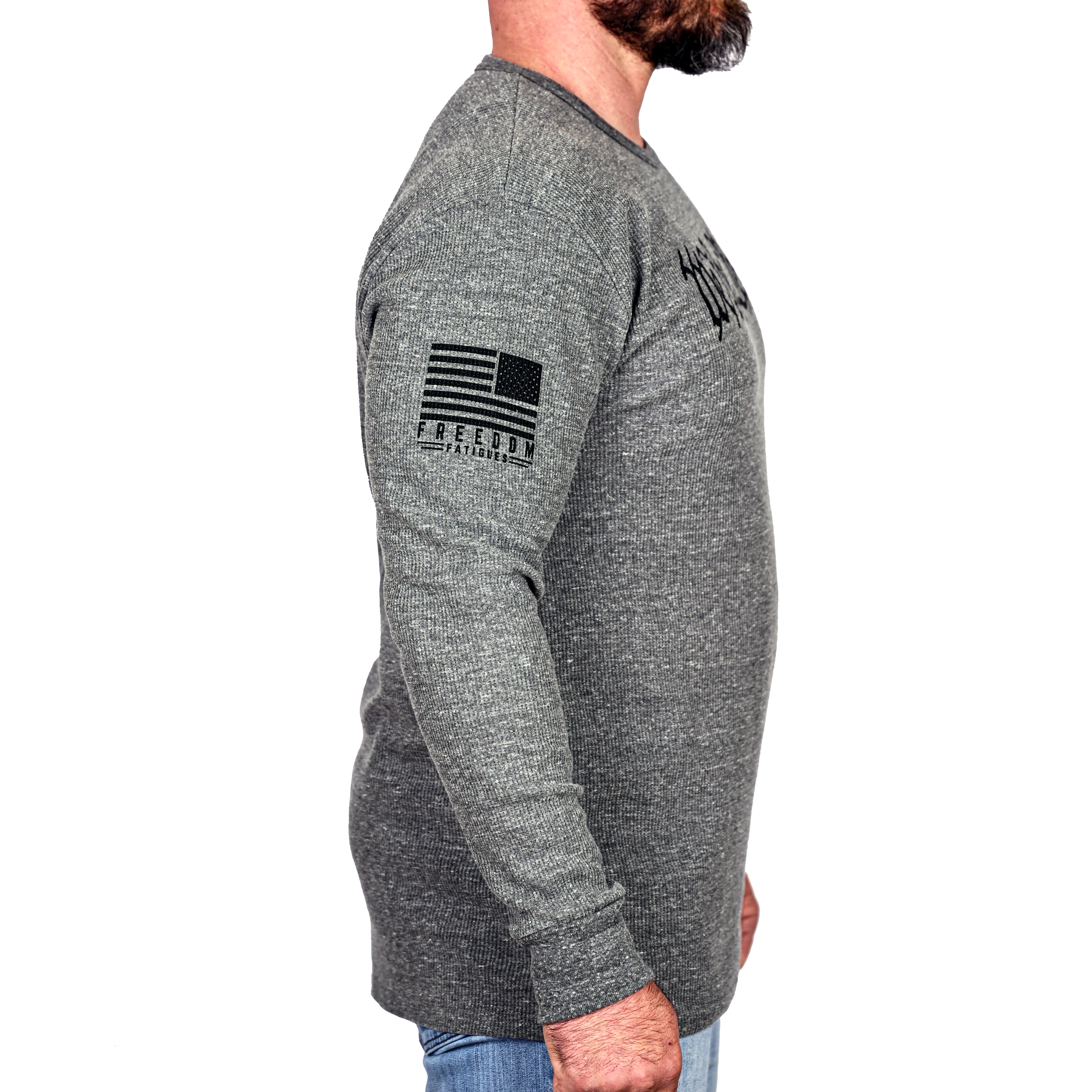 Man wearing a gray long-sleeve thermal shirt with Freedom Fatigues logo on the sleeve