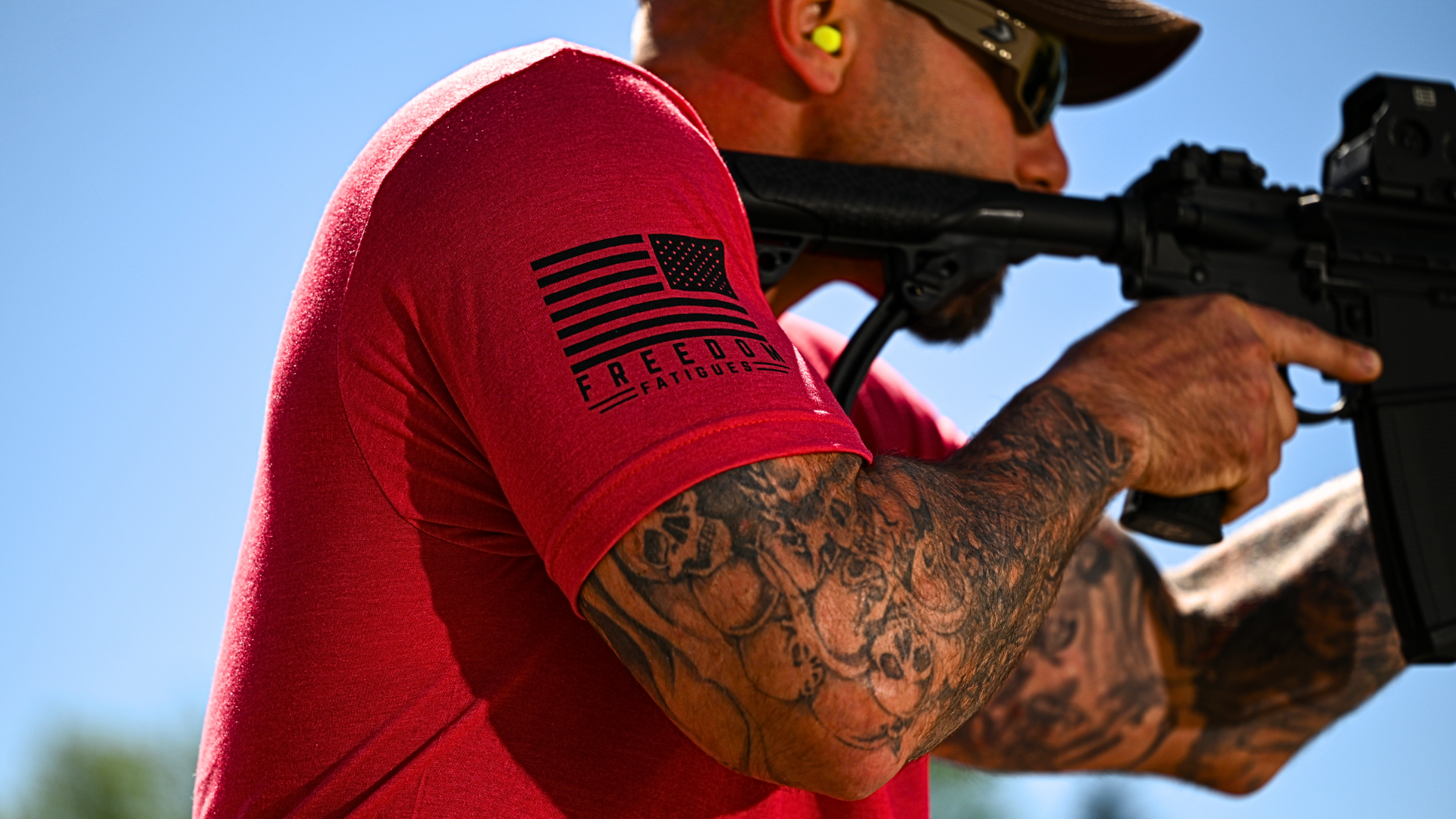 Man on a shooting range wearing a Freedom Fatigues shirt.