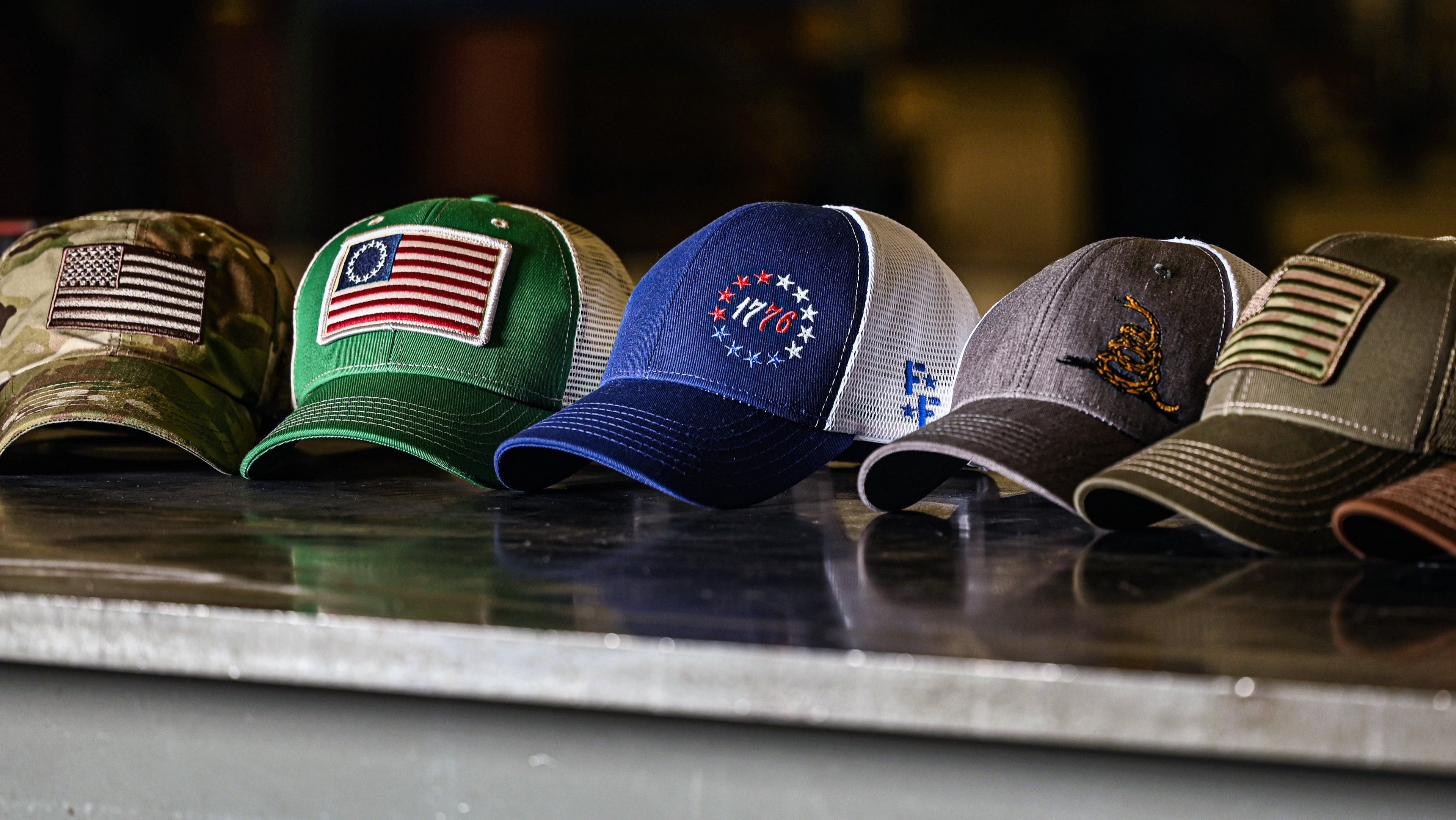 Collection of American Flag Hats On A Work Table