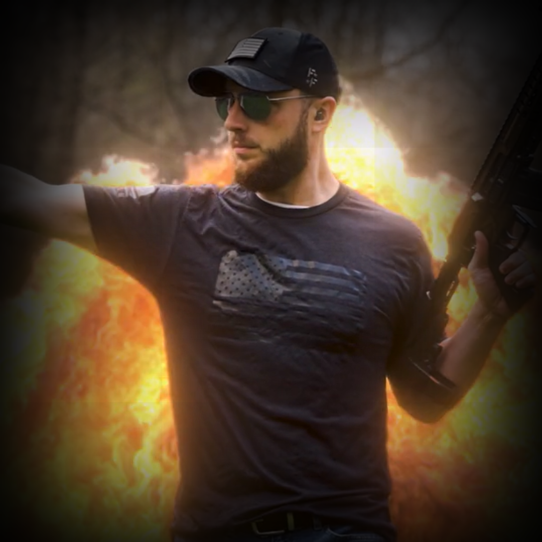 Gun Drummer holding a rifle with a fiery background