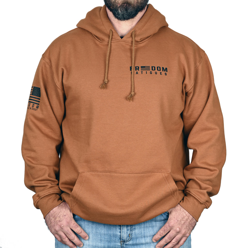 A caramel brown hoodie with a 'Freedom Fatigues' logo worn by a male model