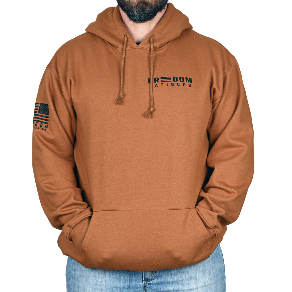 A caramel brown hoodie with 'Freedom Fatigues' branding worn by a male model