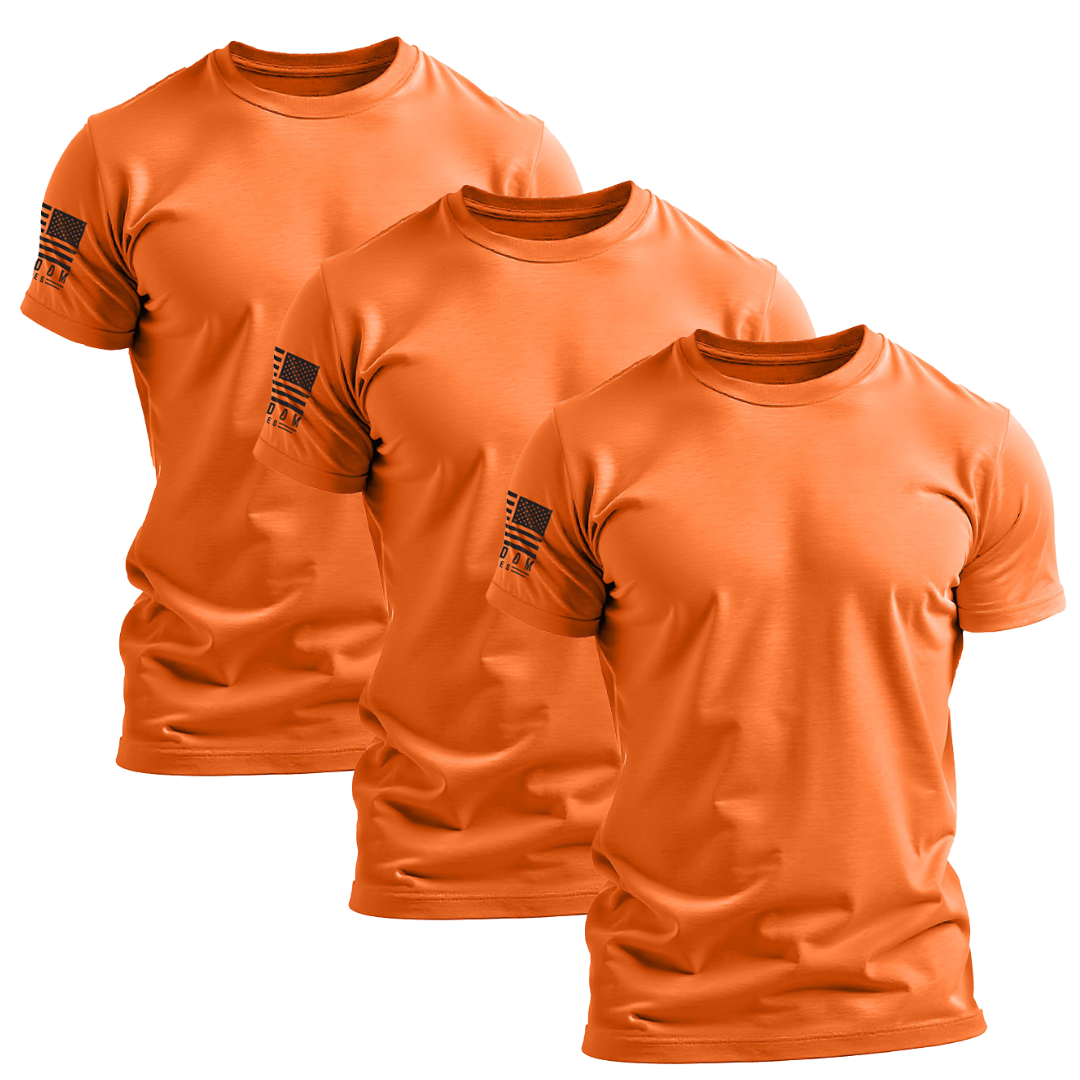 Three hi-vis orange patriotic work t-shirts with a simple design featuring an American flag on the right sleeve, displayed against a white background.