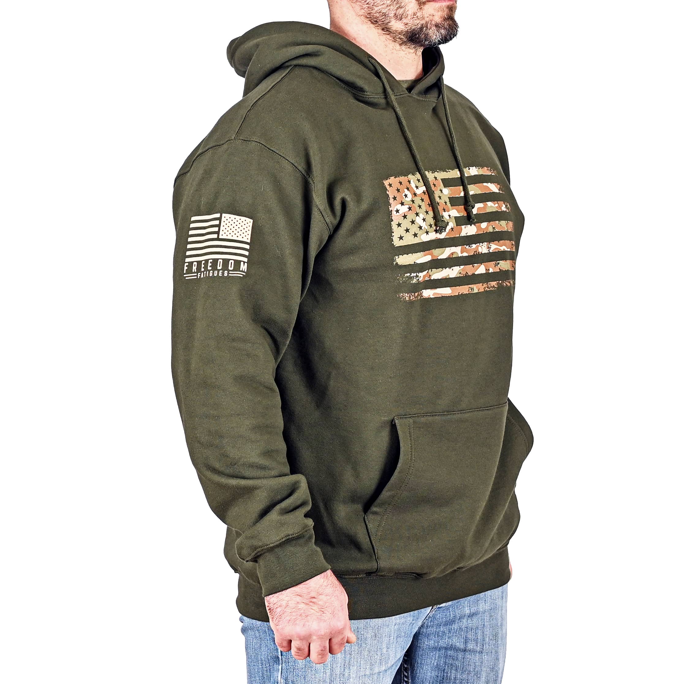 A male model wearing a black heather Men's T-shirt with the phrase 'We The People' printed in white, accompanied by graphics of crossed rifles and stars. (front view)