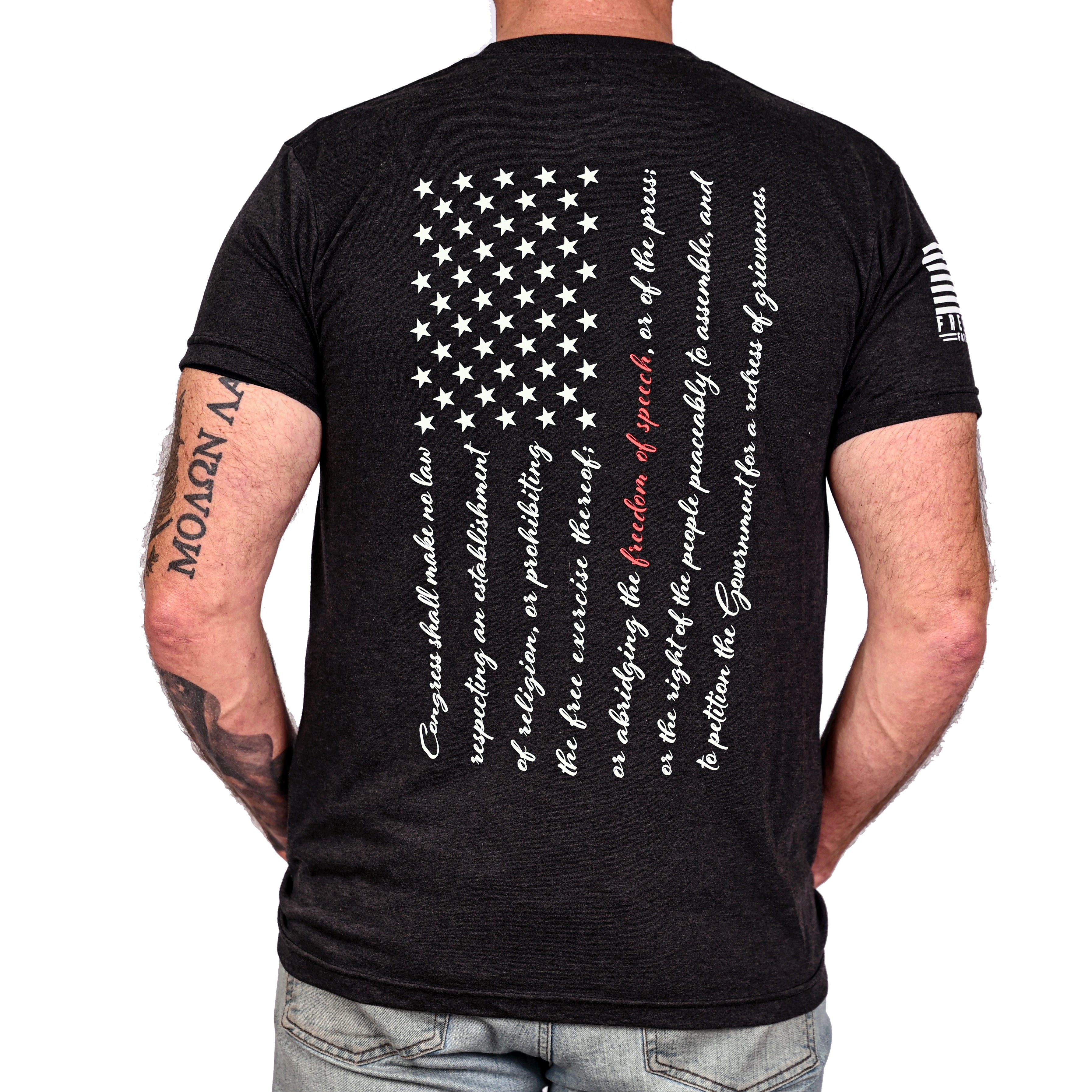 Black triblend t-shirt with an American flag composed of the first amendment text on the back worn by a model.