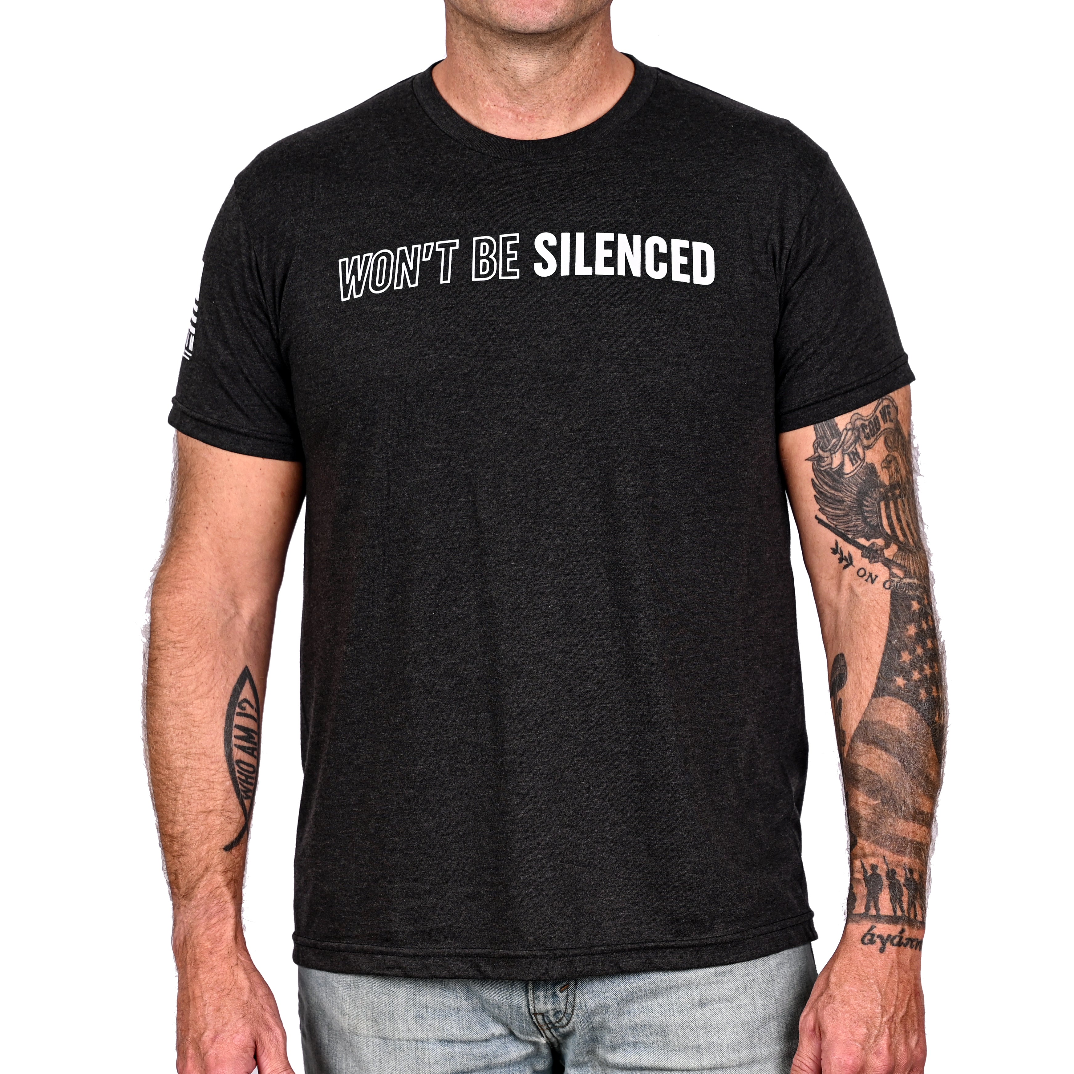 Man wearing a patriotic black t-shirt with "won't be silenced" across the front.
