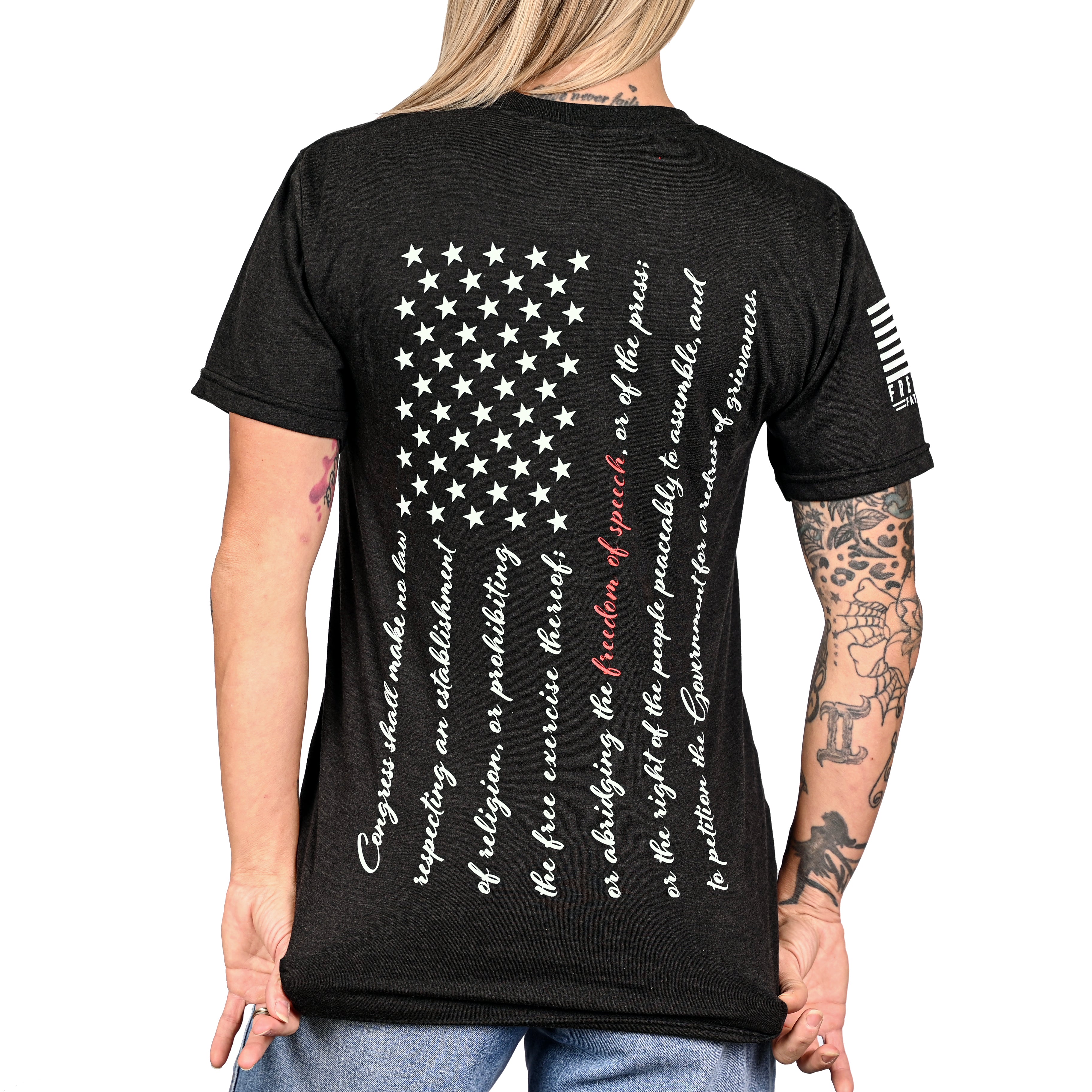 Patriotic black t-shirt with an American flag composed of the first amendment on the back and worn by a female model.