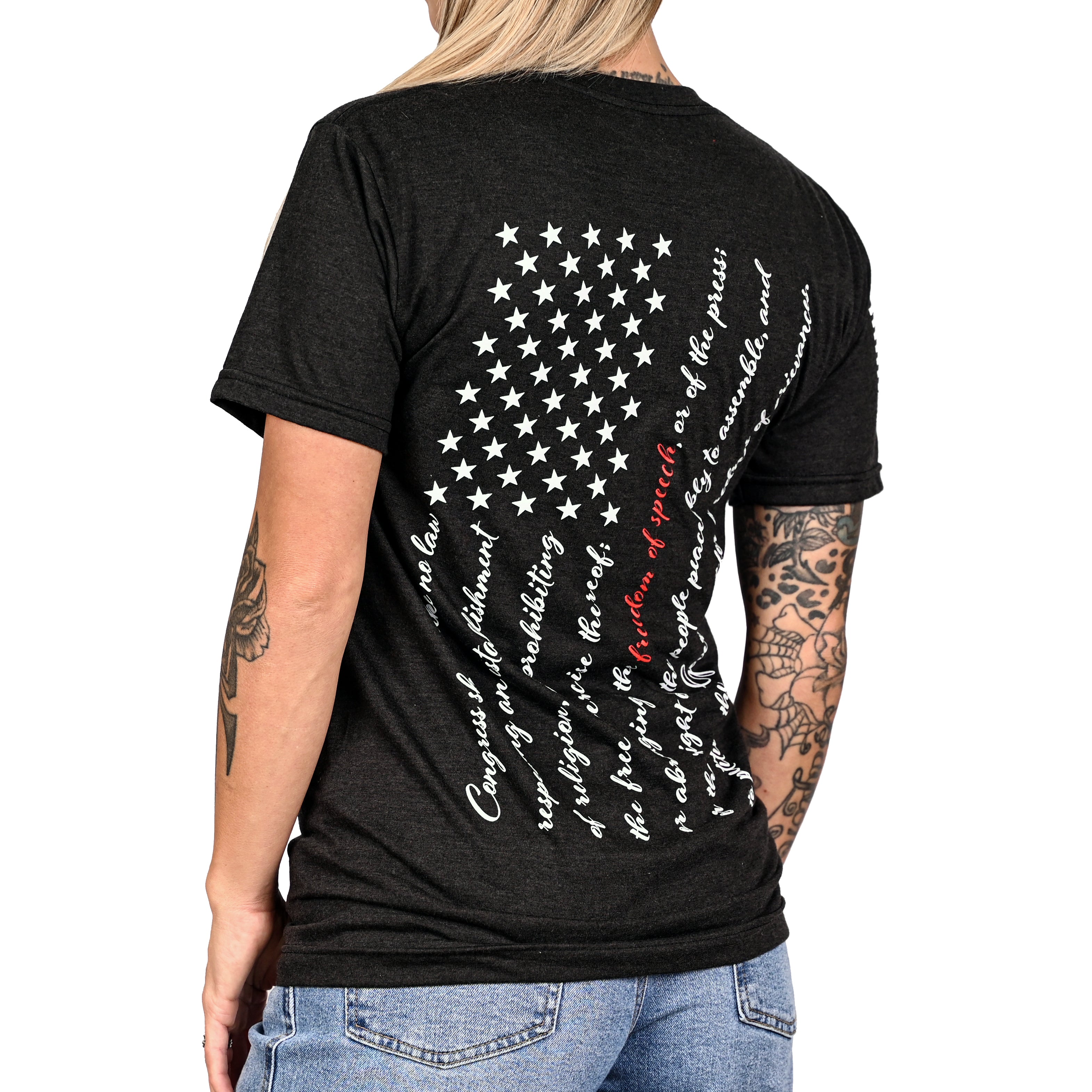 Patriotic black t-shirt with an American flag composed of the first amendment on the back and worn by a female model.
