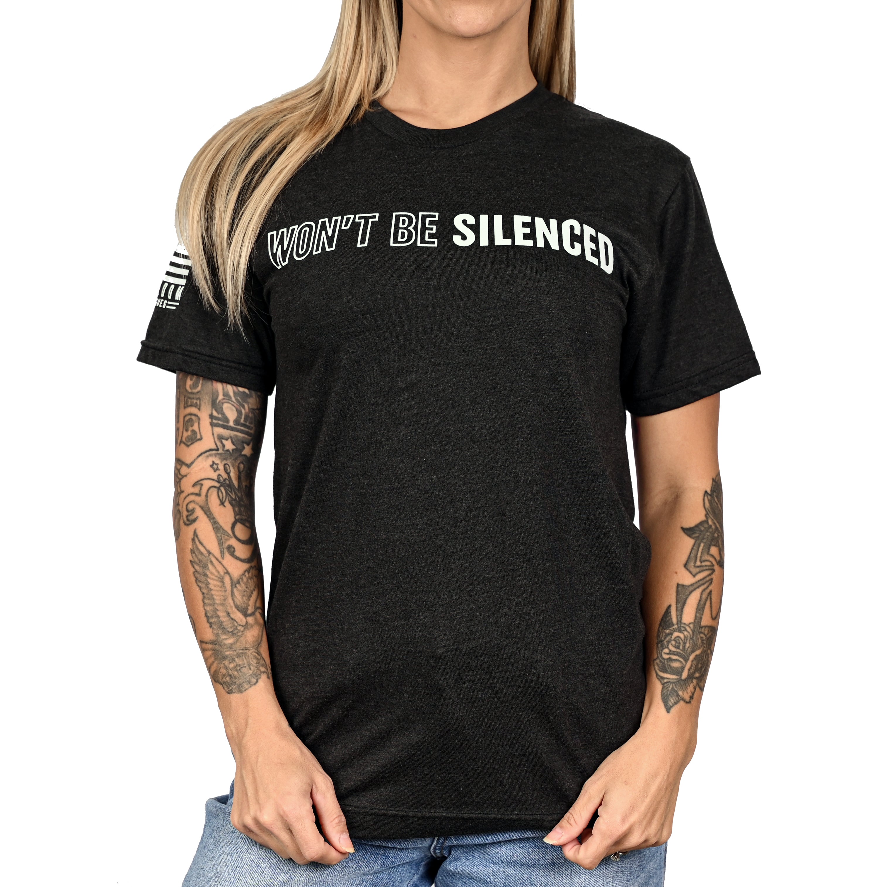 Woman wearing a patriotic black Freedom Fatigues t-shirt with 'WON'T BE SILENCED' text on the front.