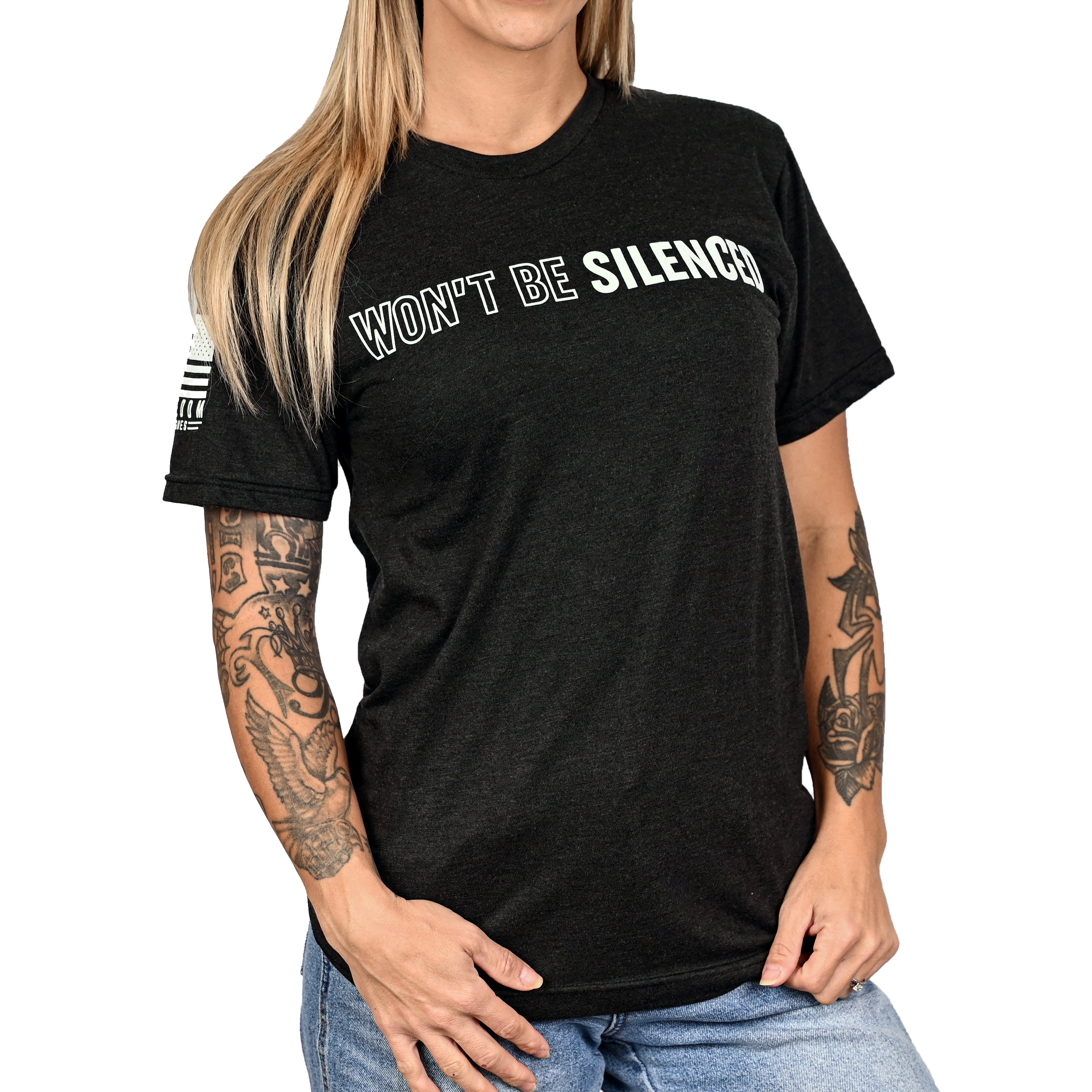 Woman wearing a patriotic black t-shirt with 'WON'T BE SILENCED' on the front.