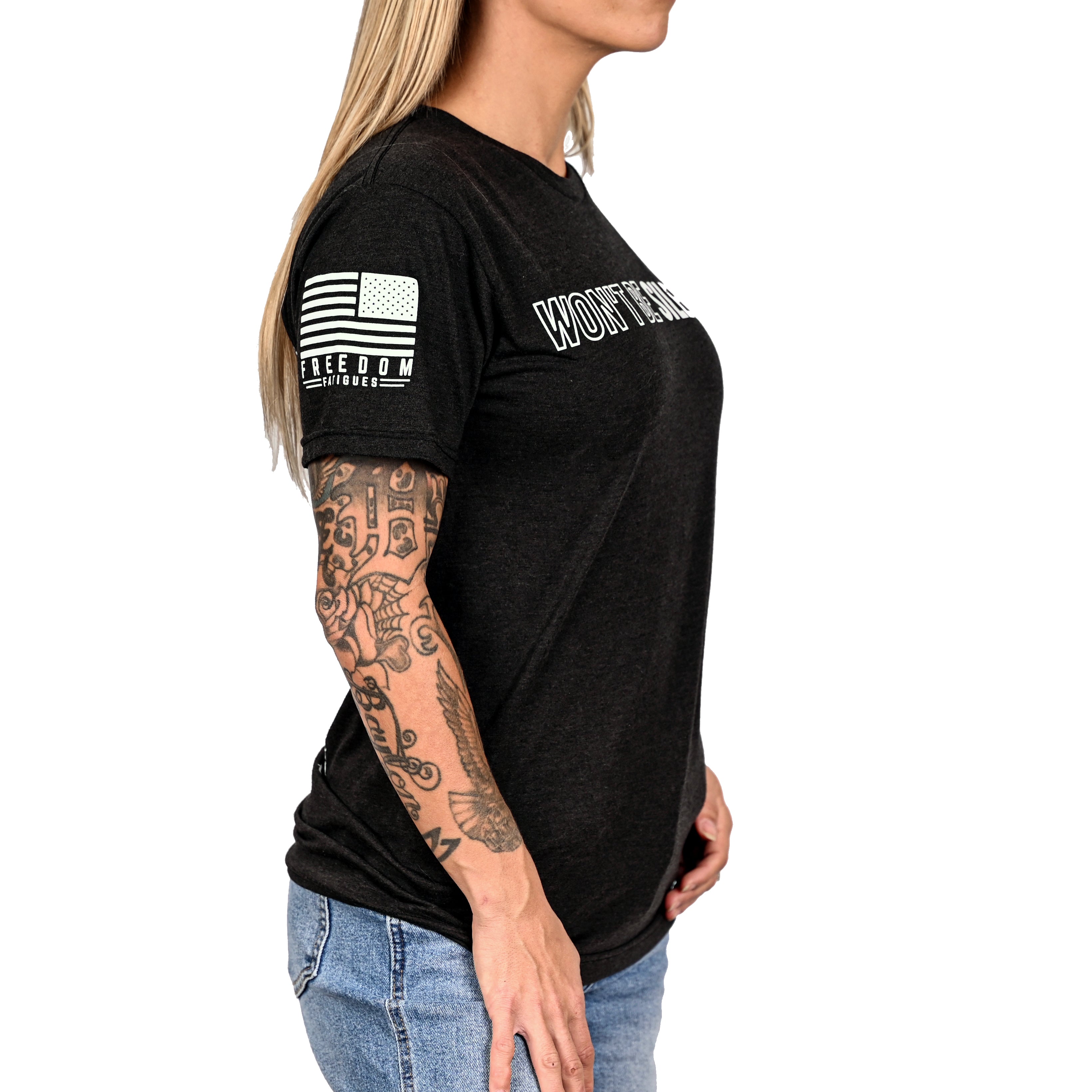 Woman wearing a patriotic black t-shirt with a Freedom Fatigues American flag sleeve. 
